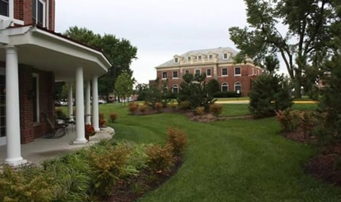 Outdoor view of the senior living community building and gardens