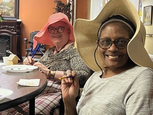 Residents engaged in a creative activity at the facility