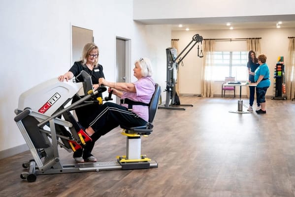 Residents engaging in exercise with staff support