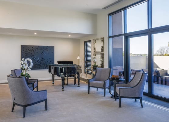 Interior lounge area with a piano and seating