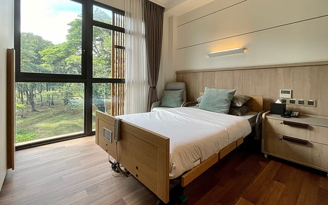 A view of a private resident room with a large window