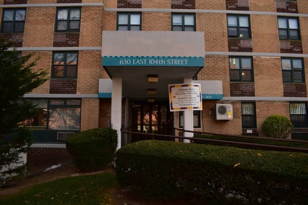Front entrance of a senior living facility with signage