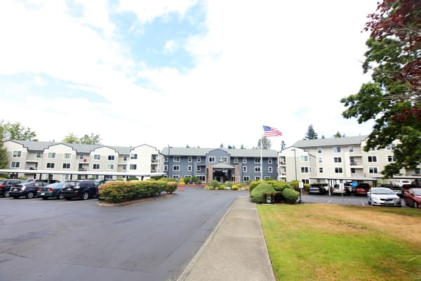 Exterior view of Cogir at The Narrows facility with landscaping
