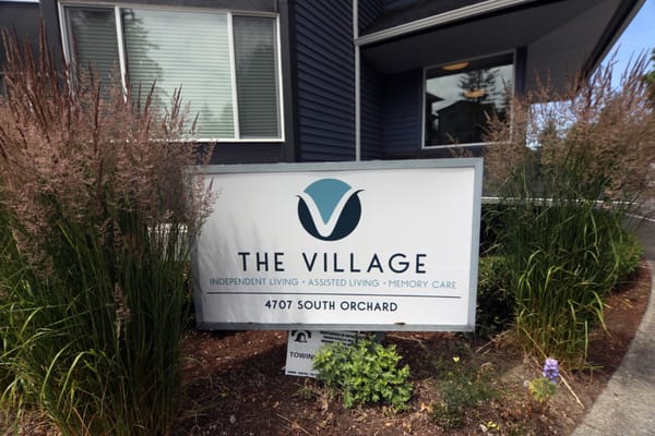 Sign for The Village Senior Living at 4707 South Orchard