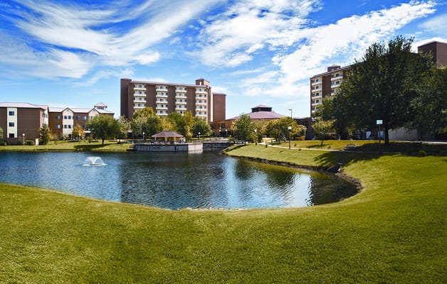 Exterior view of a pond and buildings at Blue Skies of Texas East