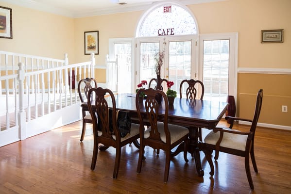 Dining area with wooden table and chairs