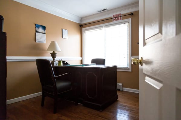 An office area with a desk and chair