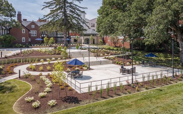 Beautifully landscaped outdoor garden area with seating