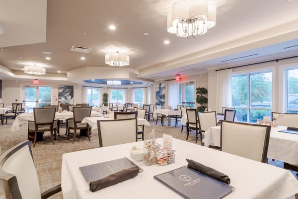 Dining room with tables set for residents