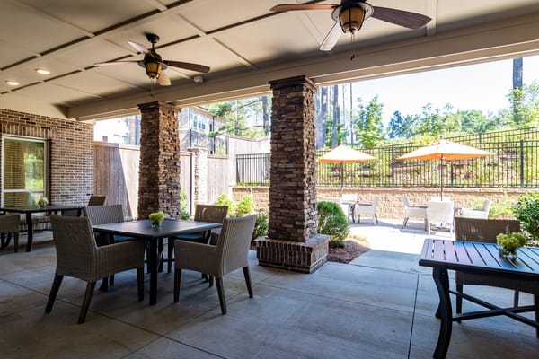 Outdoor seating area with tables and umbrellas