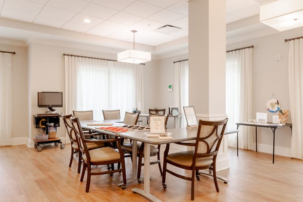 Bright common area with tables and chairs