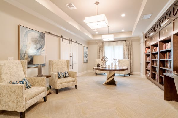 Interior common area with seating and bookshelves
