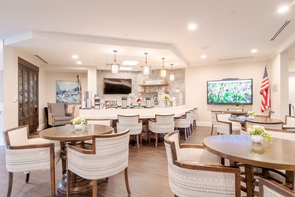 Bright common area with tables and seating