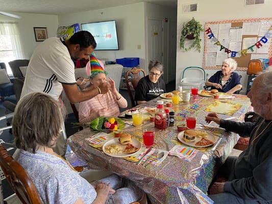 Residents celebrating with food and decorations