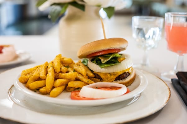 A delicious burger meal served on a white plate