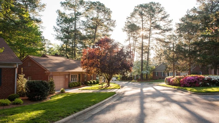 Scenic view of the retirement community with trees and landscaping