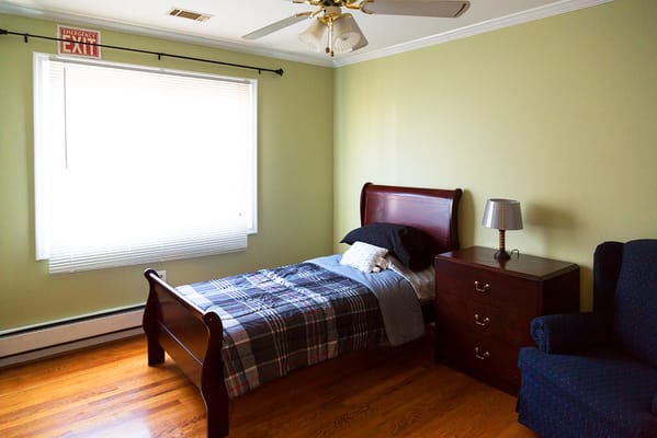 Cozy resident bedroom with bed and furniture