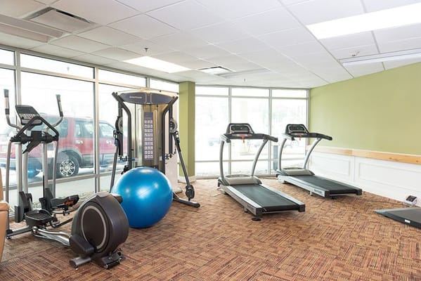 Interior view of a fitness area with gym equipment