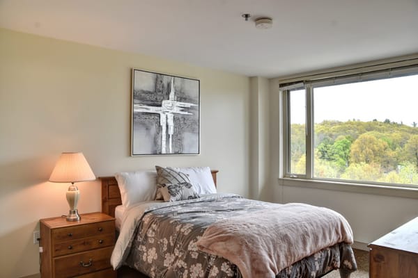 Cozy bedroom with a bed and window view