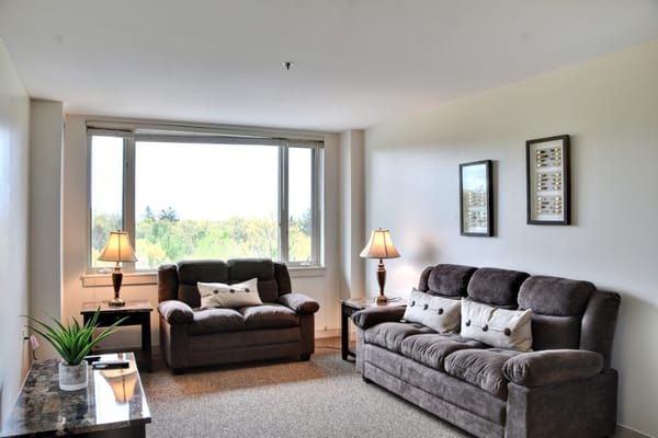 Bright common area with comfortable seating and large windows