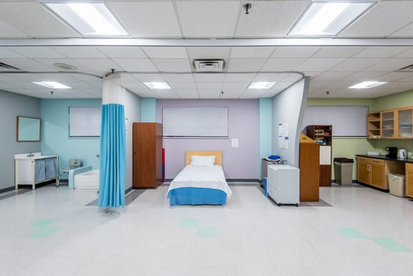 Private room with a bed and cabinetry