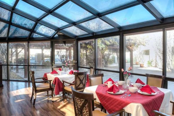 Interior dining room with decorated tables and flowers