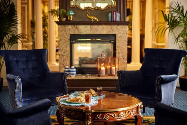 Cozy lounge area with chairs and snacks on a table