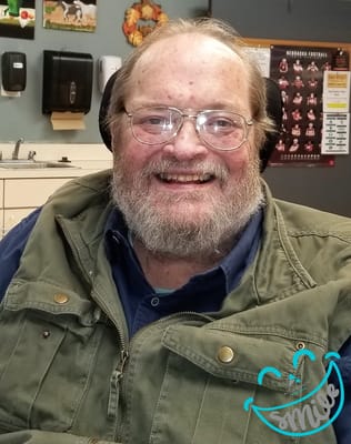 Smiling resident in a casual setting