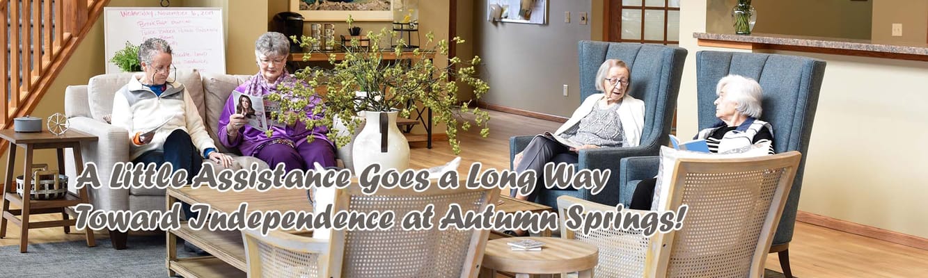 Residents enjoying a common area with comfortable seating