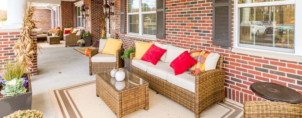 Outdoor seating area with sofas and colorful cushions