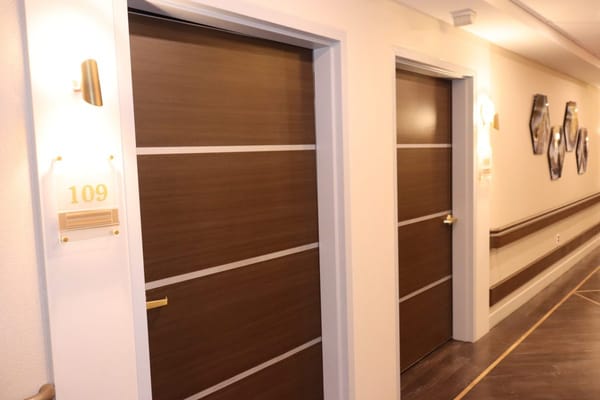 Hallway with private resident room doors