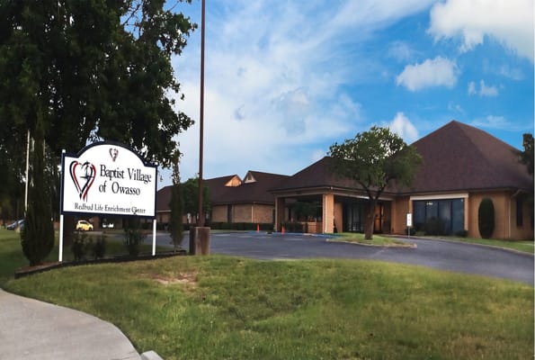Exterior view of Baptist Village of Owasso building and signage