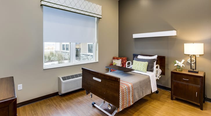 Cozy private resident room with a bed and natural light