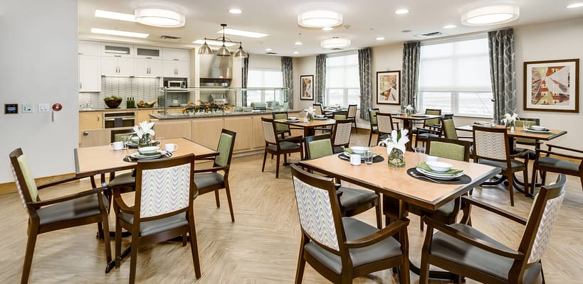 Bright dining room with tables set for meals