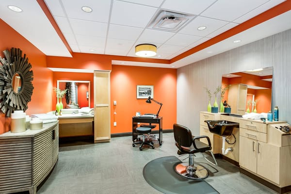 Brightly lit salon area with modern decor