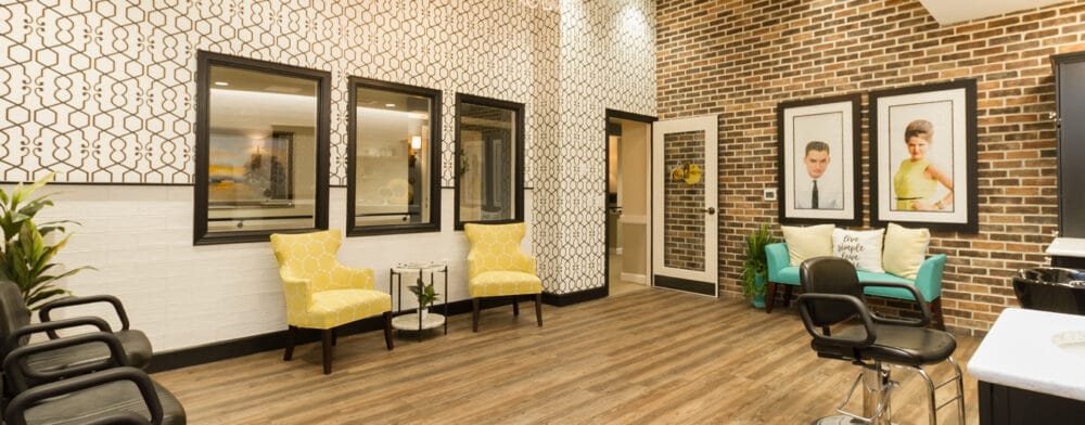 Common area with seating and decorative walls