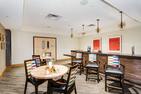 Interior view of a dining area with colorful chairs