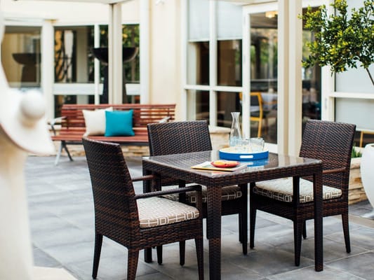 Outdoor dining area with a table and chairs