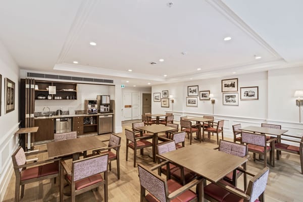 Spacious dining room with wooden tables and chairs