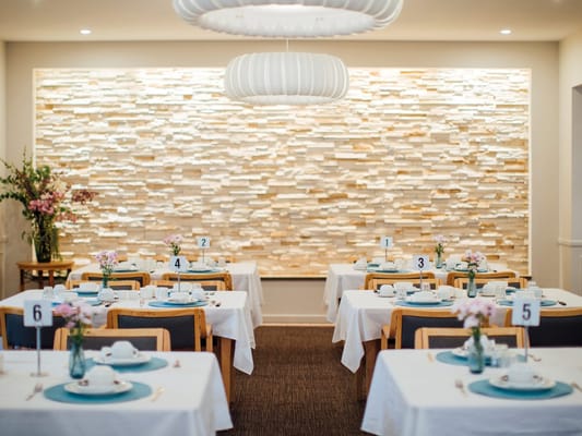 Dining room set for a meal in a bright interior