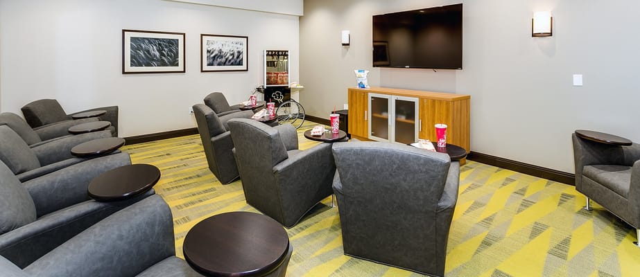 Interior lounge area with armchairs and a television