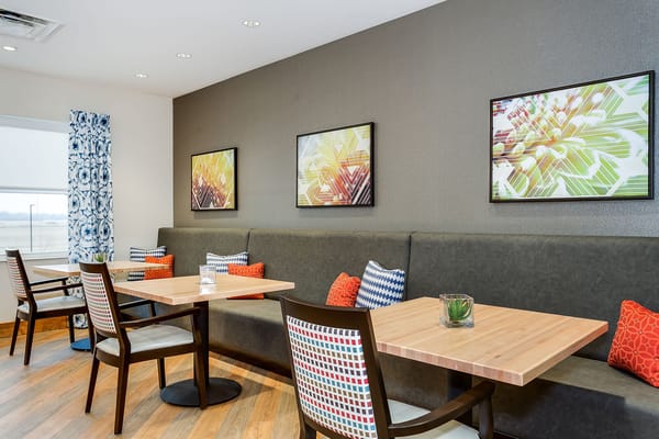 Interior dining area with tables and artwork