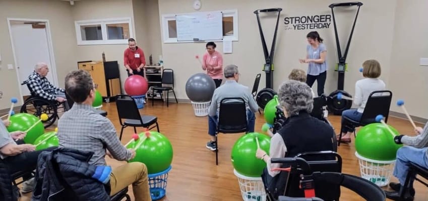 Residents participating in a group exercise activity