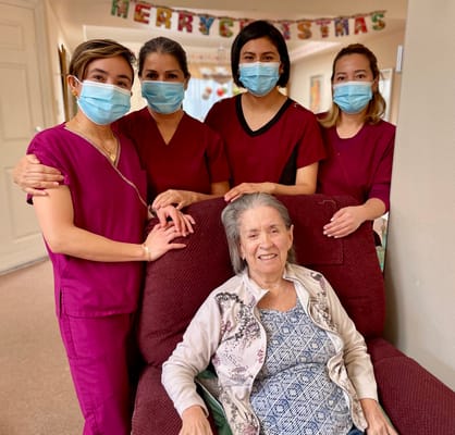 Staff and resident posing together for a photo