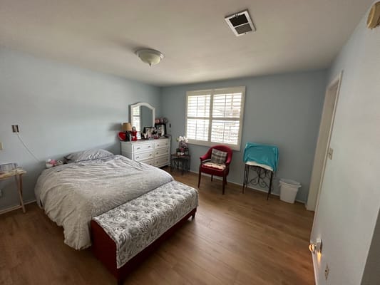 Cozy private resident room with bed and furniture