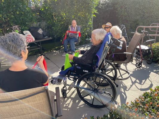 Residents enjoying activities in an outdoor space