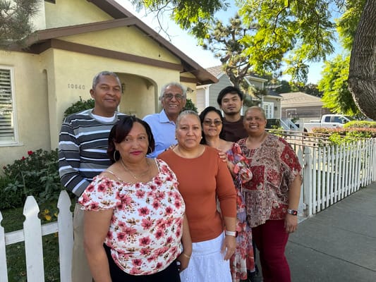 Group of seven people in front of the residential care home
