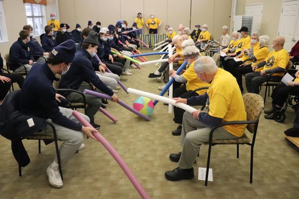 Residents and staff participating in a group activity