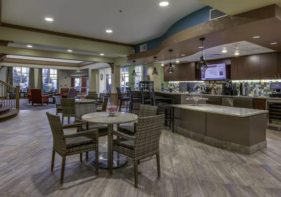 Bright common area with seating and bar