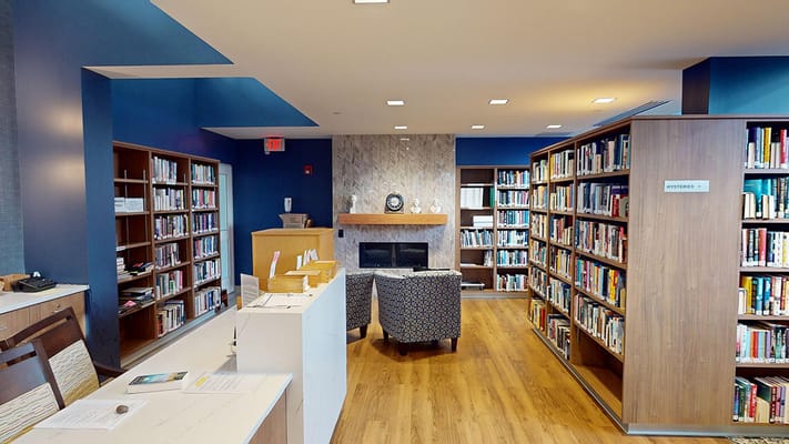 Bright library area with shelves and seating